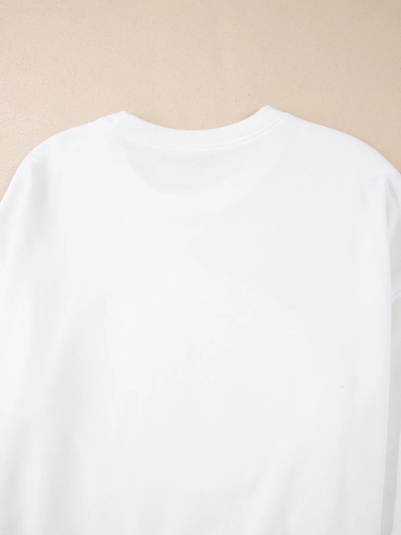 A plain white long-sleeve sweatshirt is shown from the back.