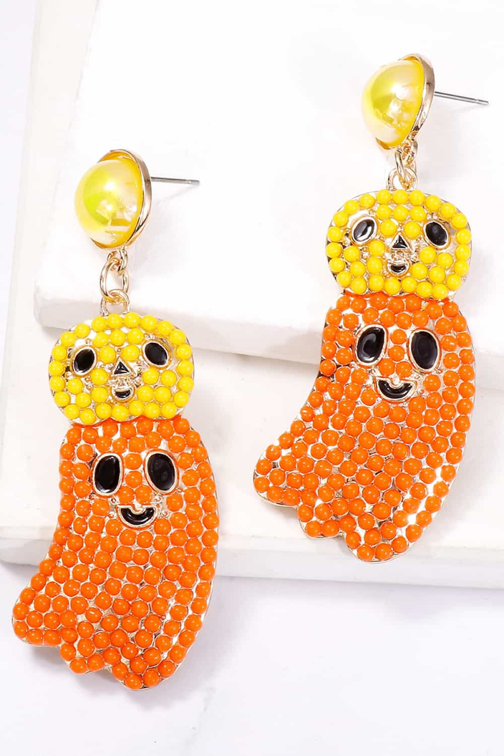 Halloween ghost shape dangle earrings with yellow and orange beads.