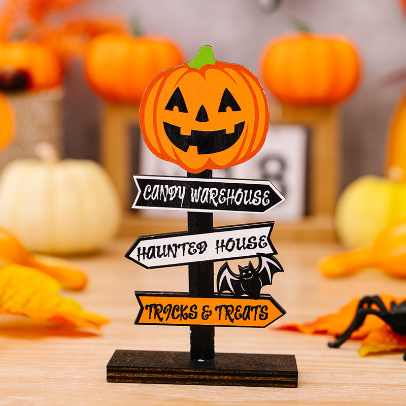 A wooden Halloween sign with a jack-o'-lantern on top and three directional arrows.