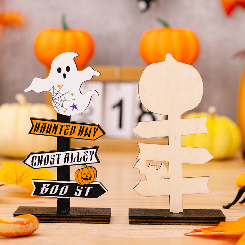 Two wooden Halloween ornaments, one with a ghost and directional signs, the other a blank pumpkin sign.