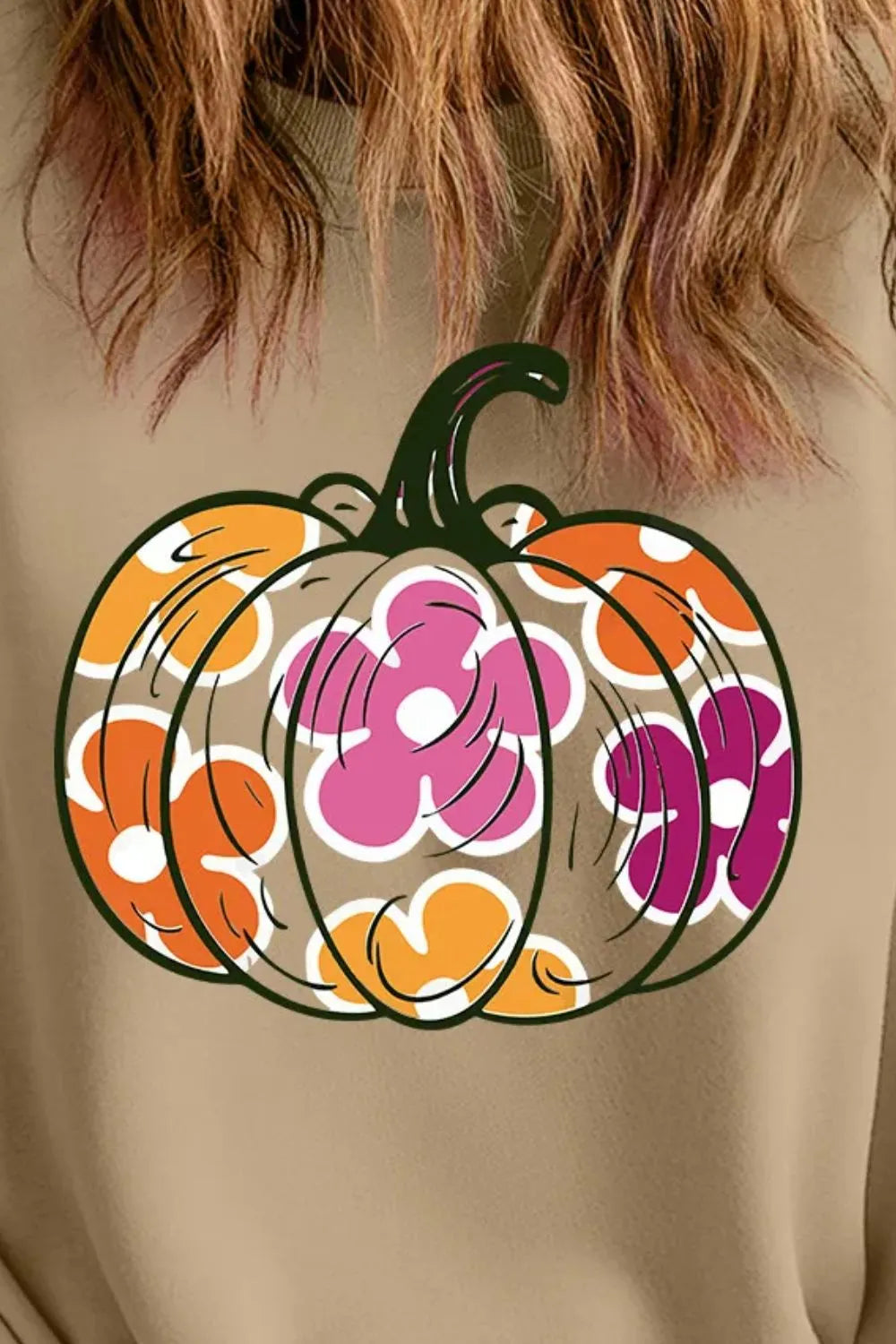 Plus size pumpkin graphic dropped shoulder sweatshirt with floral design.
