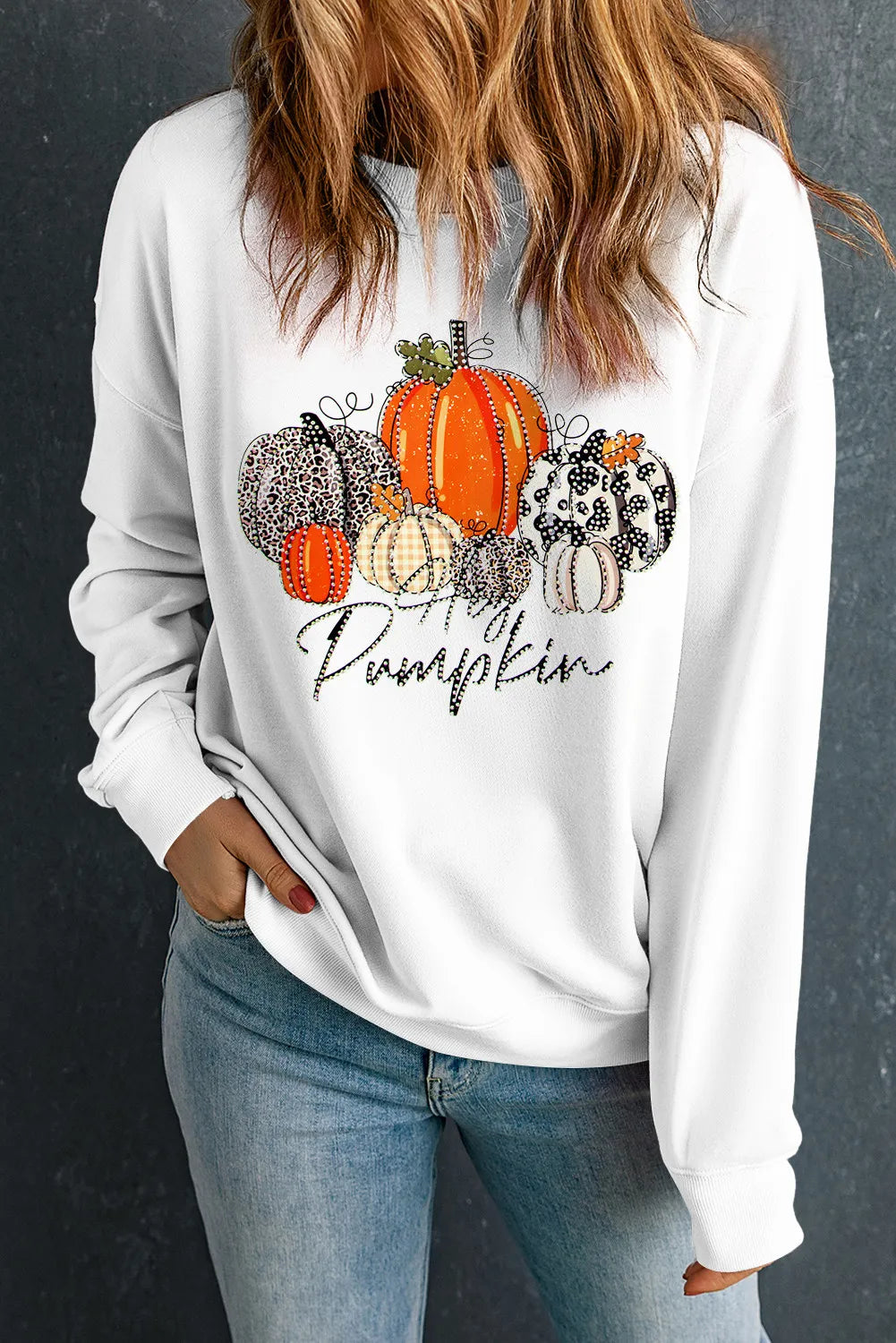 White sweatshirt with a pumpkin graphic and "Hey Pumpkin" text.