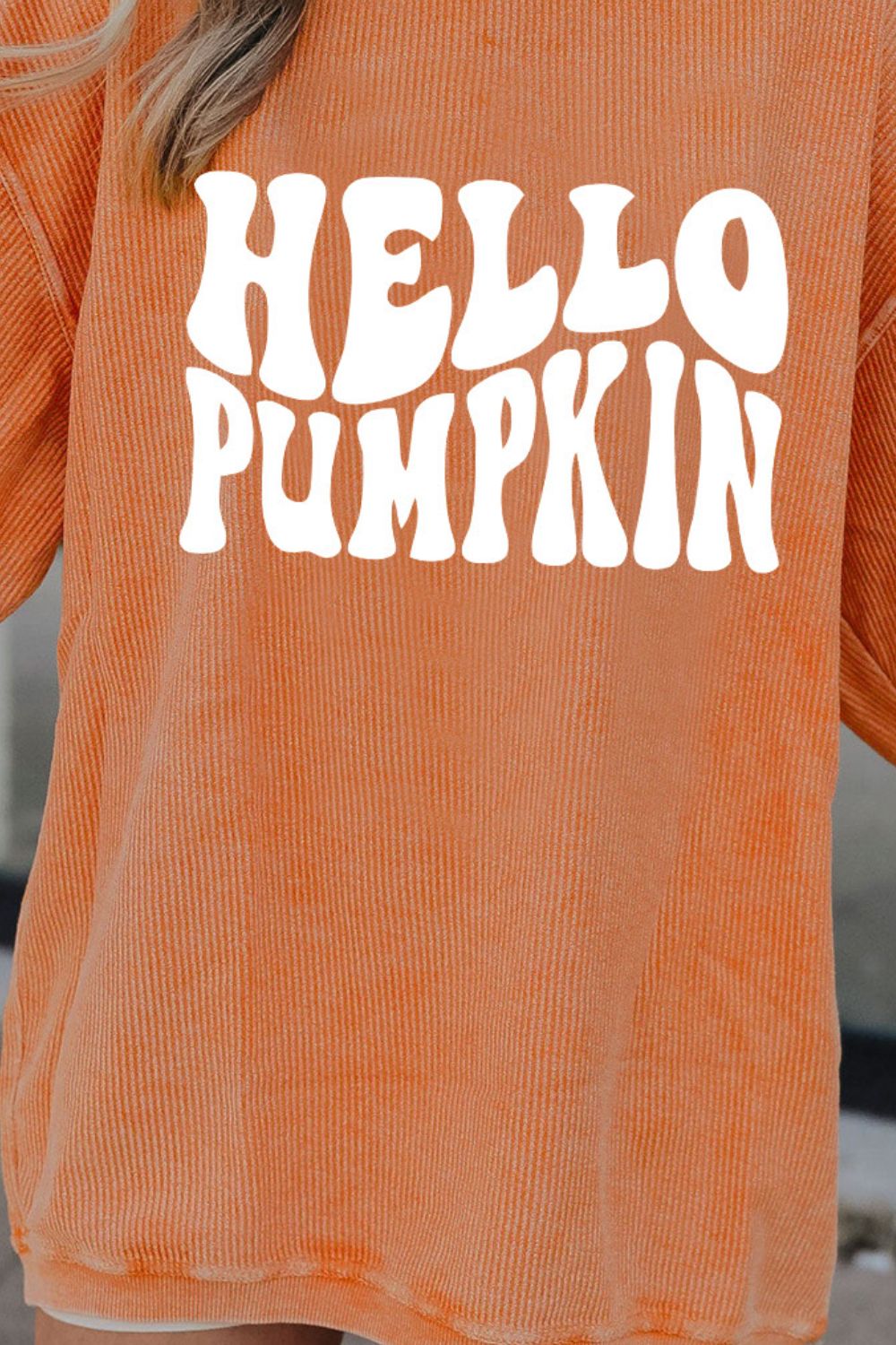 Orange corduroy sweatshirt with "HELLO PUMPKIN" graphic.