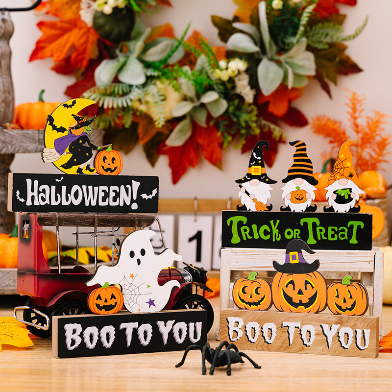 Assorted Halloween ornaments including witches, gnomes, ghosts, and pumpkins.