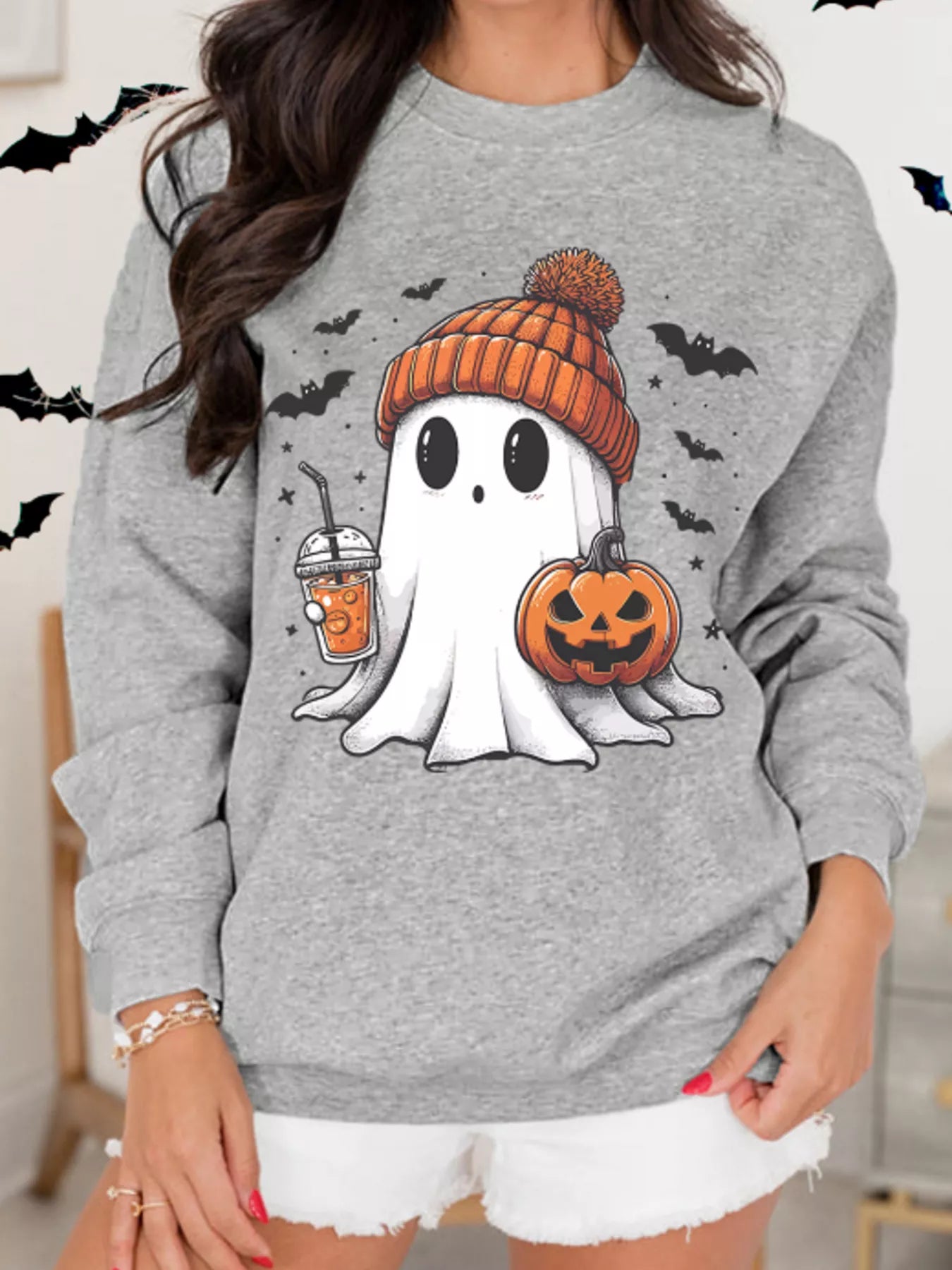 Halloween Ghost Round Neck Sweatshirt with a ghost wearing a beanie, holding a drink and pumpkin.