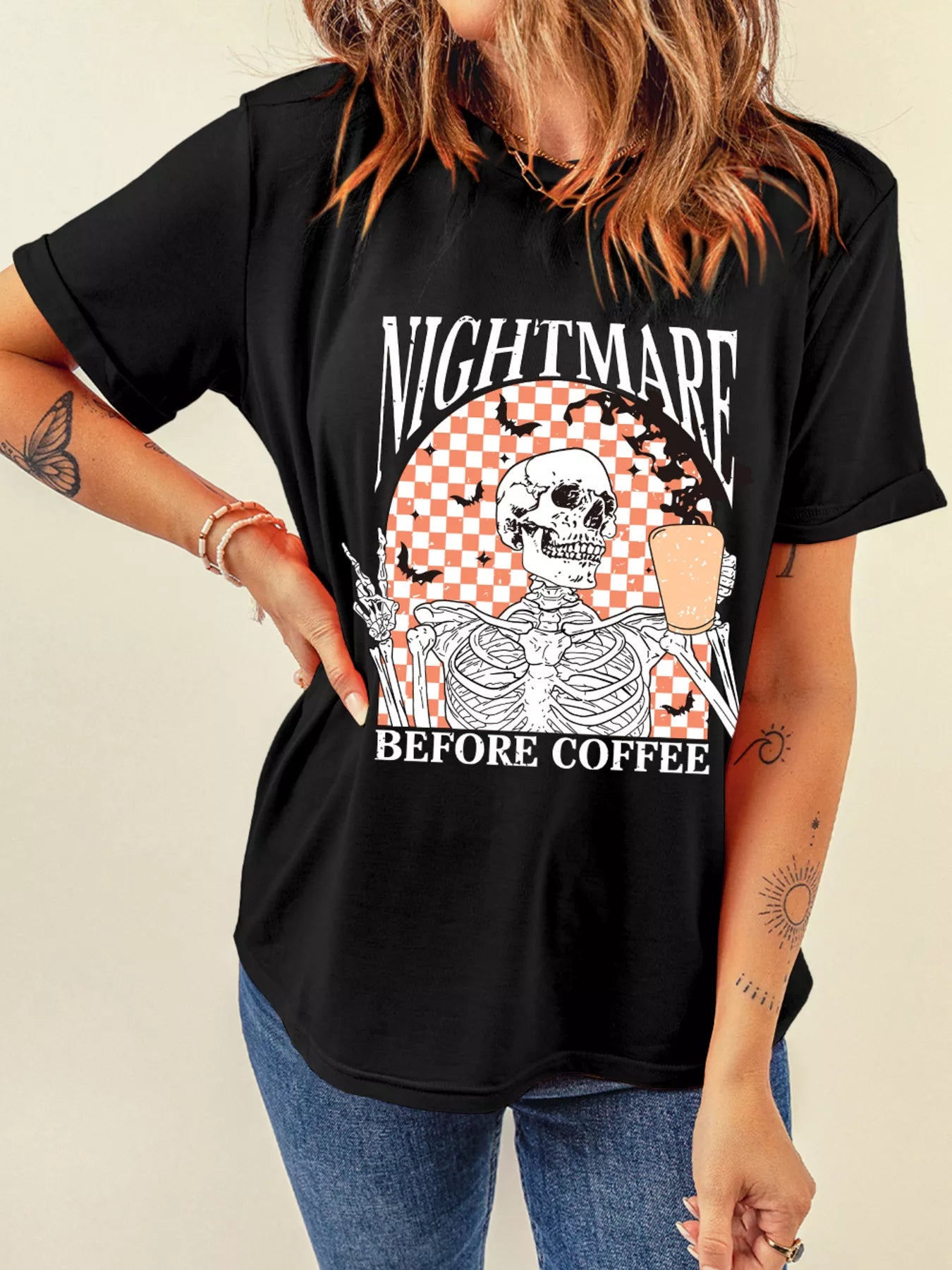 Black tee with a skeleton holding coffee and "NIGHTMARE BEFORE COFFEE" text.