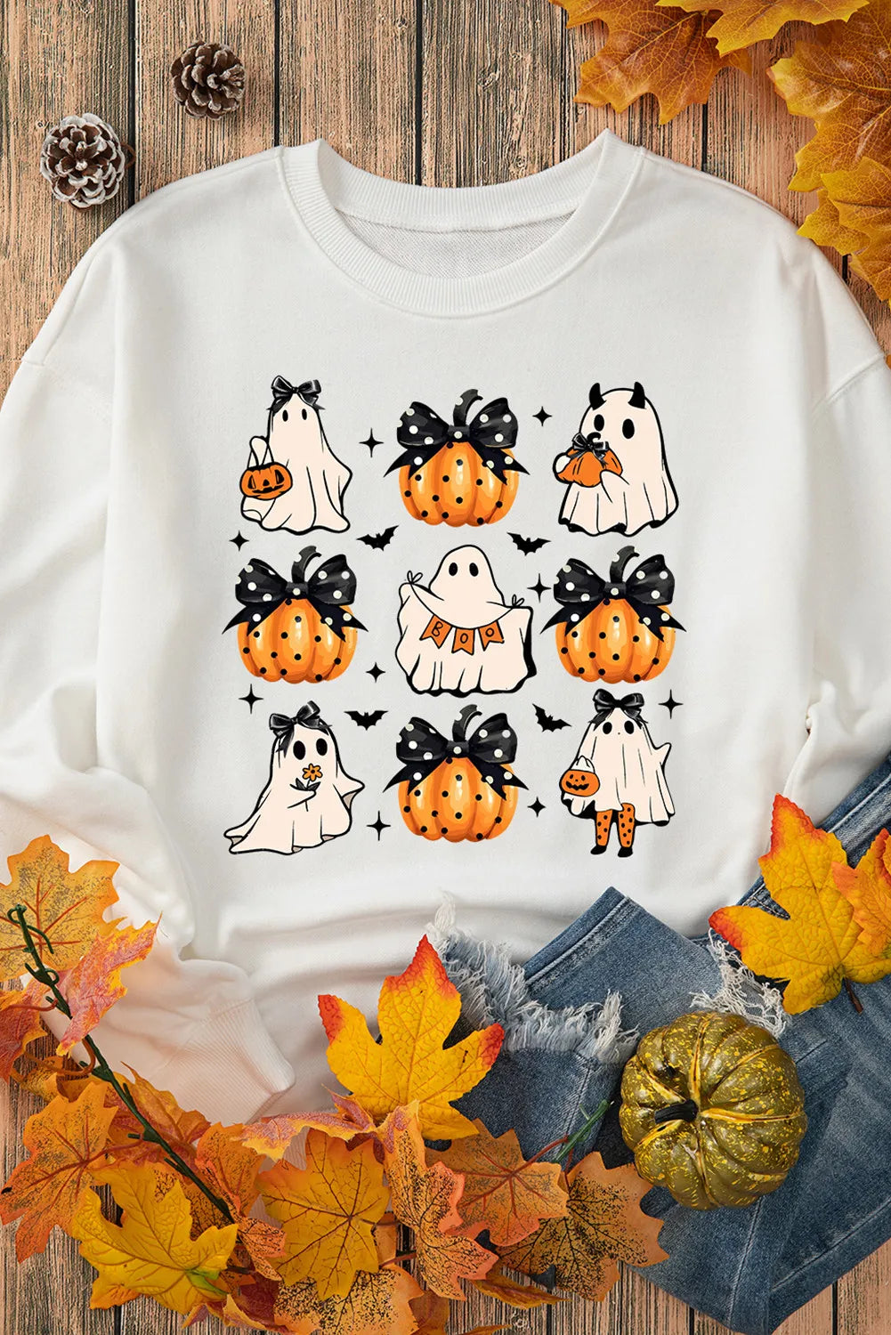White long-sleeve sweatshirt with a Halloween ghost and pumpkin print.