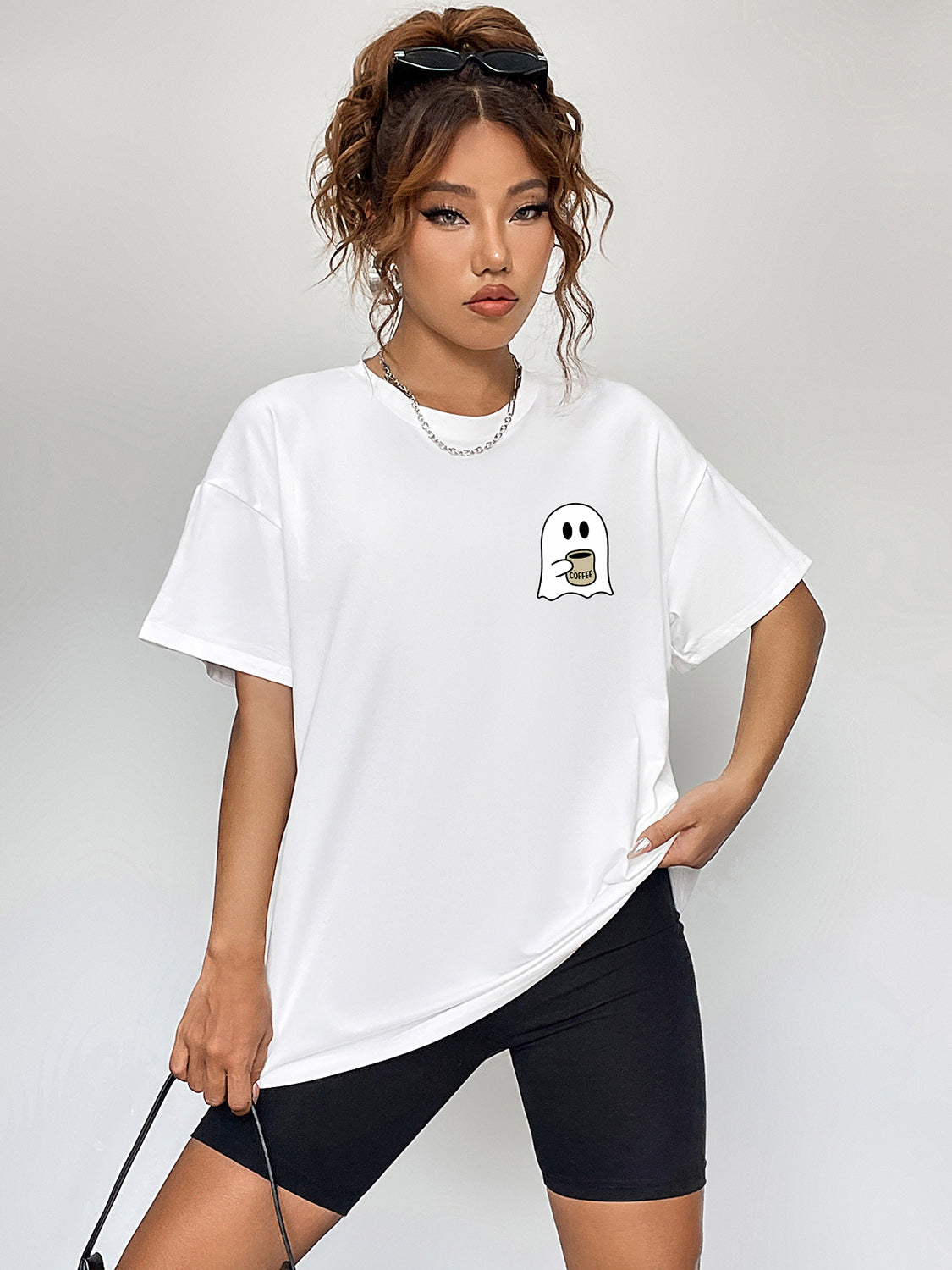 White round neck short sleeve t-shirt with a ghost graphic.