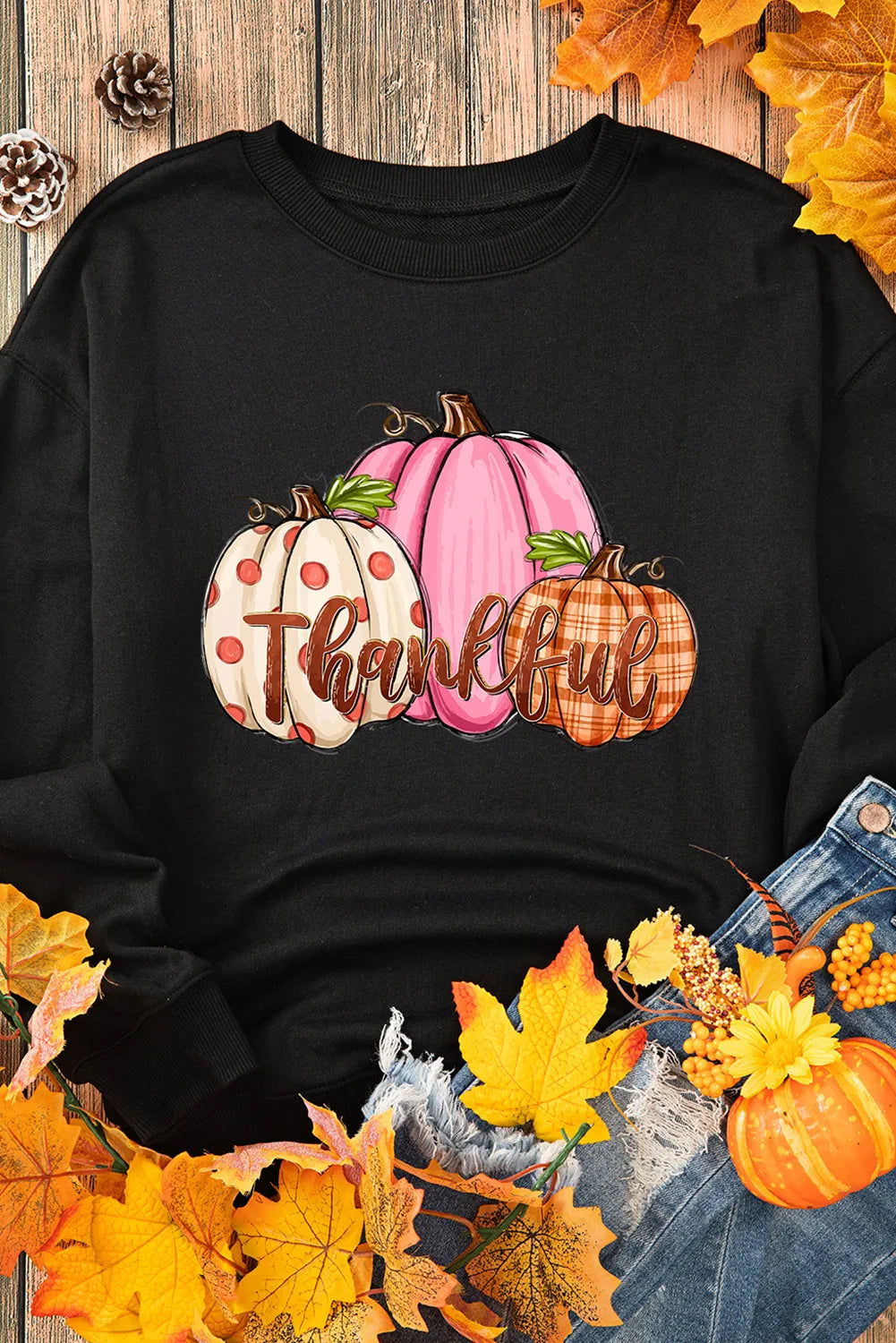 Black sweatshirt with a "Thankful" pumpkin graphic.