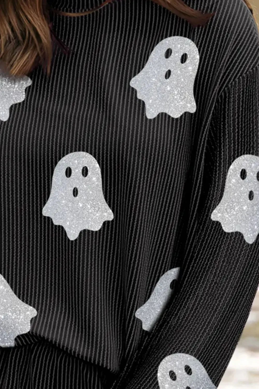 A black long-sleeve top with vertical stripes and glitter ghost designs.