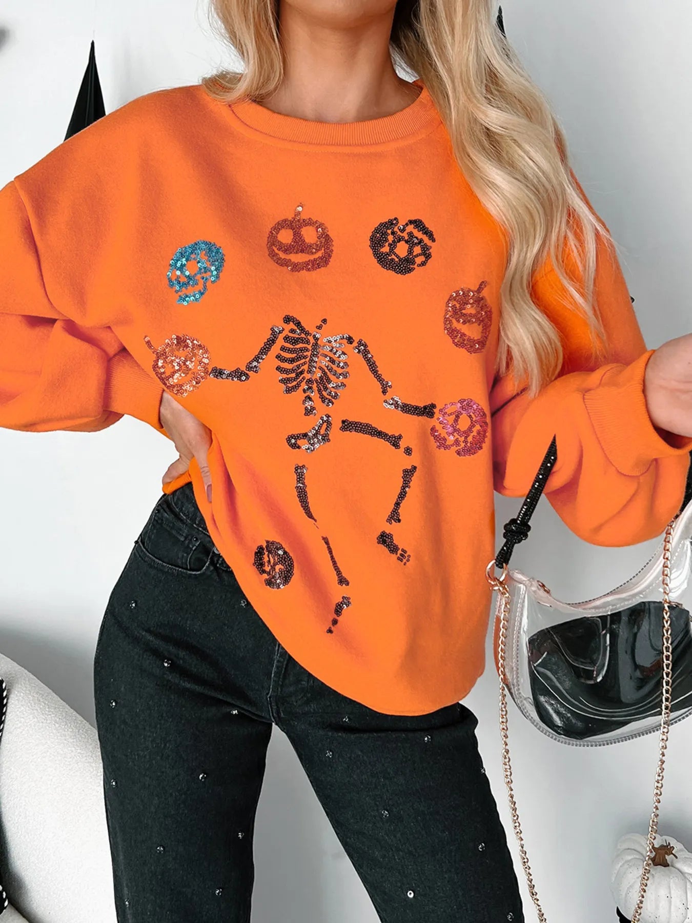 Halloween Skeleton Pumpkin Sweatshirt with sequin details.