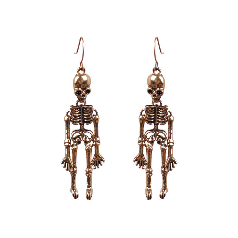Two bronze-colored skeleton alloy earrings hang from hooks.