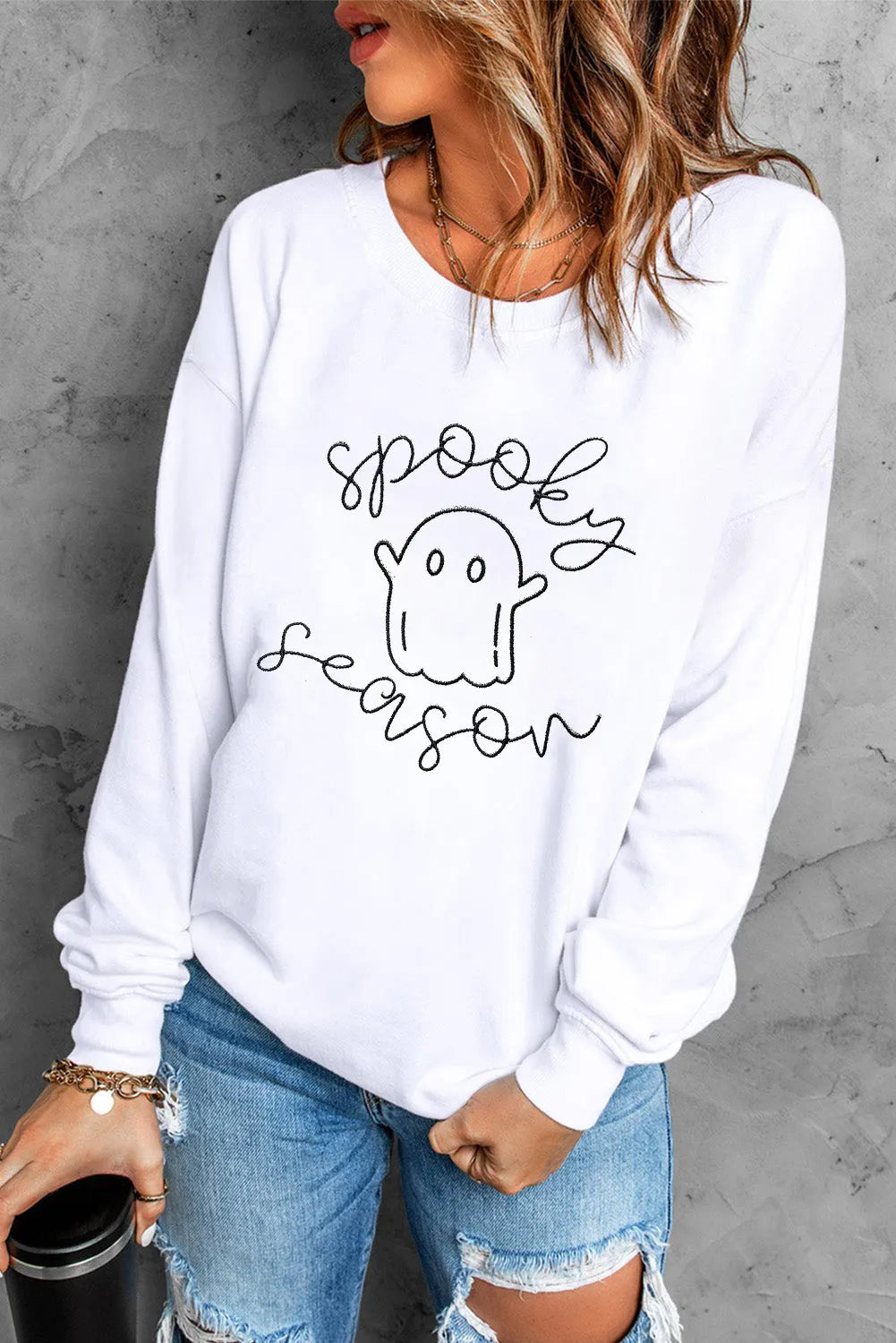 White long-sleeve sweatshirt with a "Spooky Season" ghost graphic.