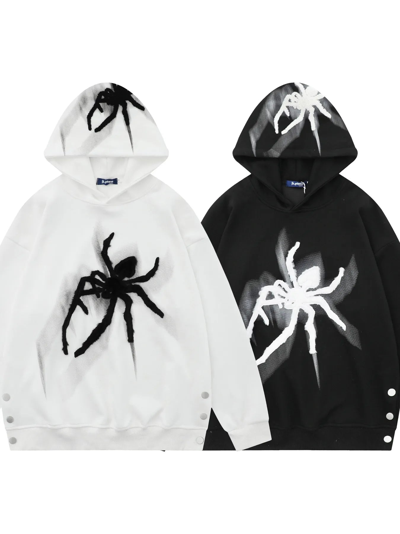 Two oversized hoodies, one white and one black, with spider graphics and side buttons.