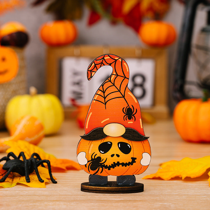 A wooden Halloween gnome with a pumpkin body, spiderweb hat, and mustache.