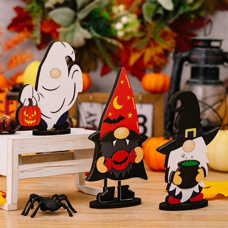 Assorted Halloween element ornaments including a ghost, vampire gnome, and witch gnome.