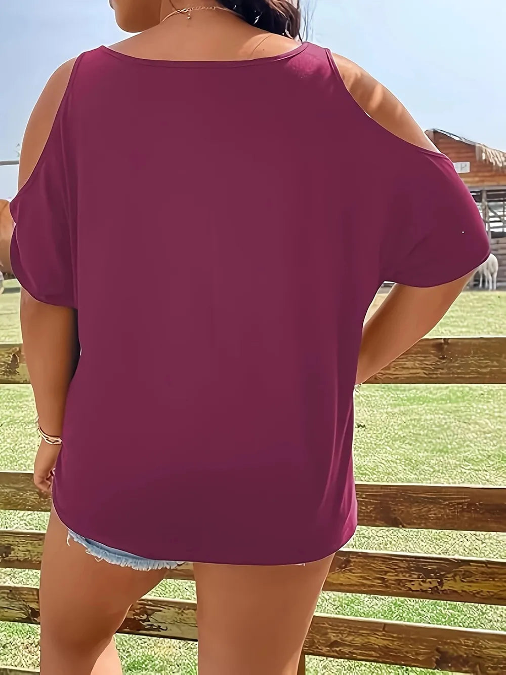 Plus size cold shoulder t-shirt in a solid maroon color.