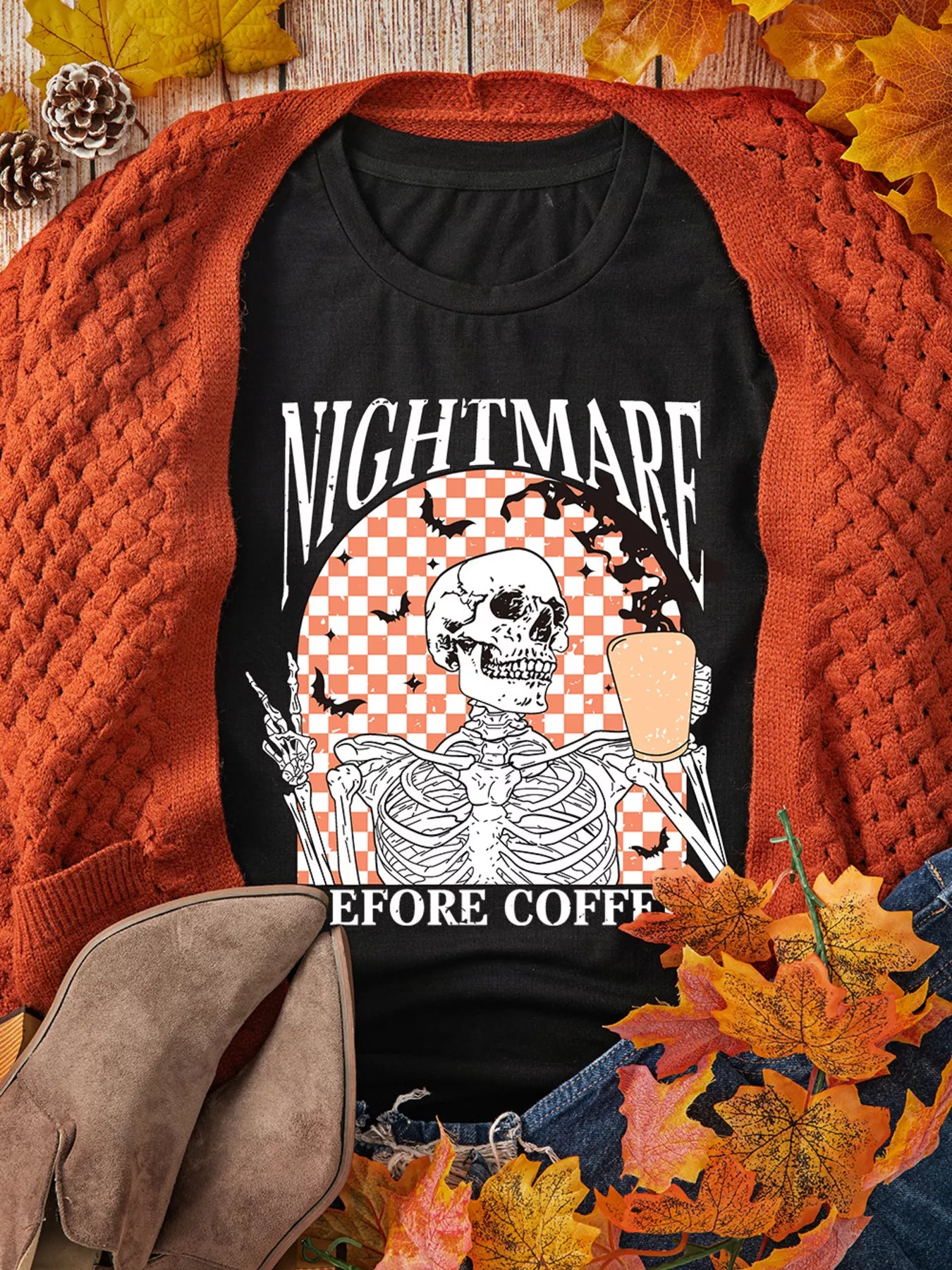 Black tee with a skeleton holding coffee and "NIGHTMARE BEFORE COFFEE" text.
