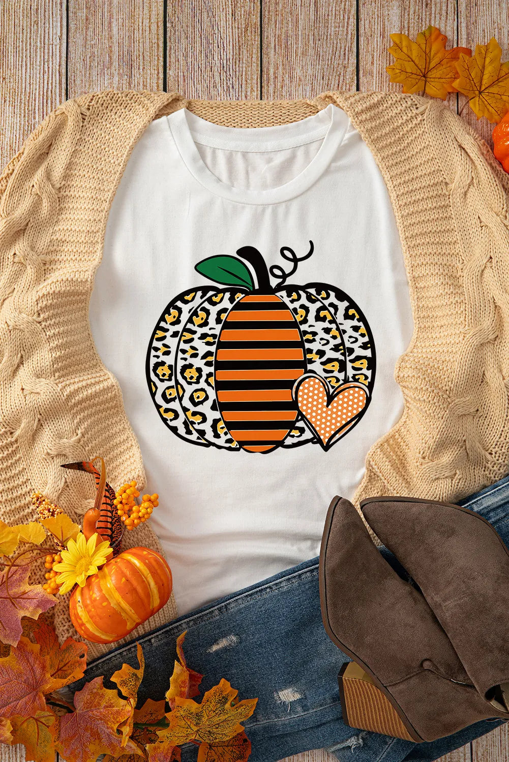 White short-sleeve t-shirt with a leopard print and striped pumpkin graphic.