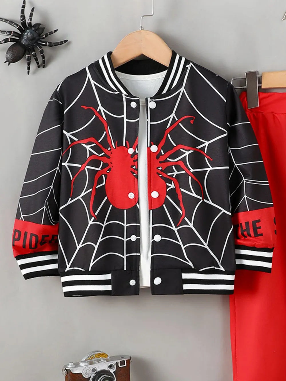 Black and red spiderweb baseball collar top and red pants set.