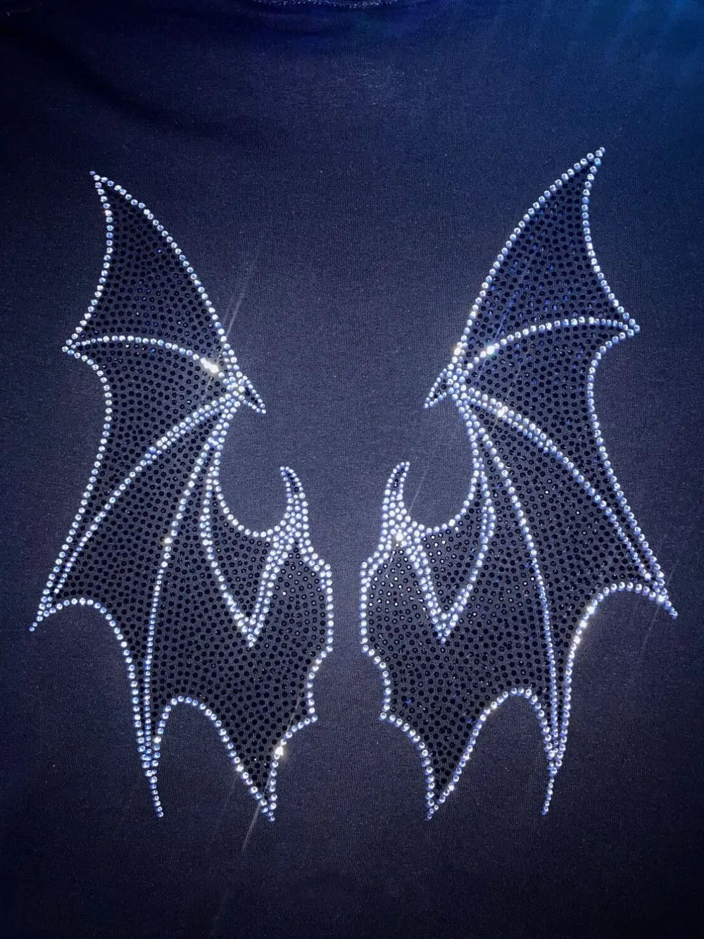 Black hoodie with two sparkling rhinestone bat wings on the back.