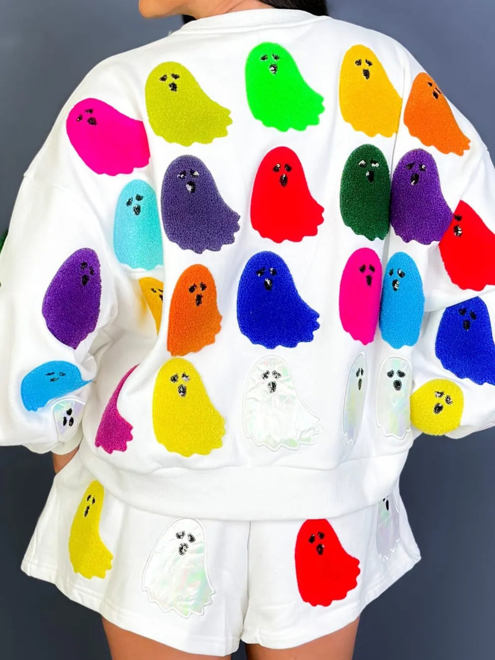 White long-sleeve top and shorts set with colorful ghost appliques.