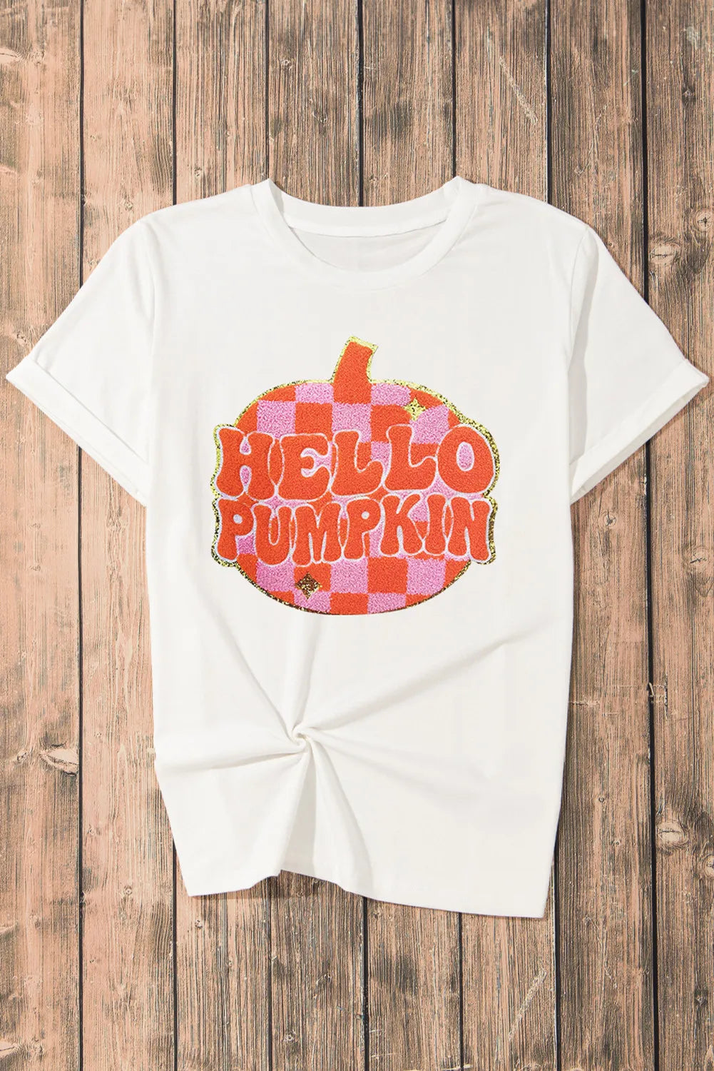White short-sleeve t-shirt with a "Hello Pumpkin" graphic on a checkered pumpkin.
