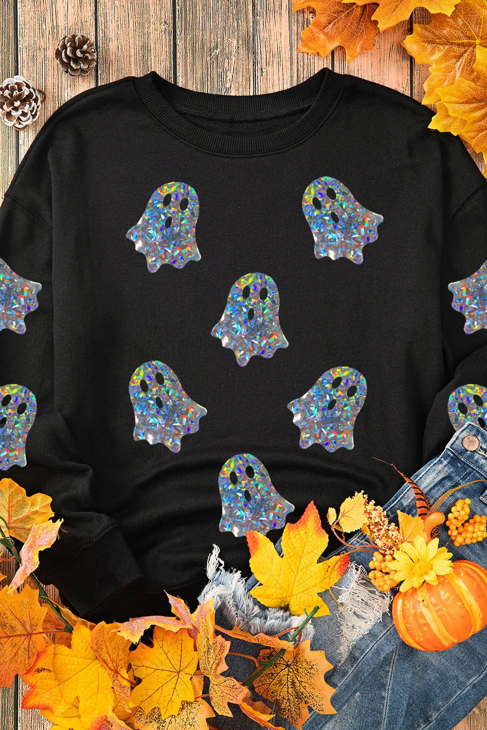 Black long-sleeve sweatshirt with holographic ghost graphics.