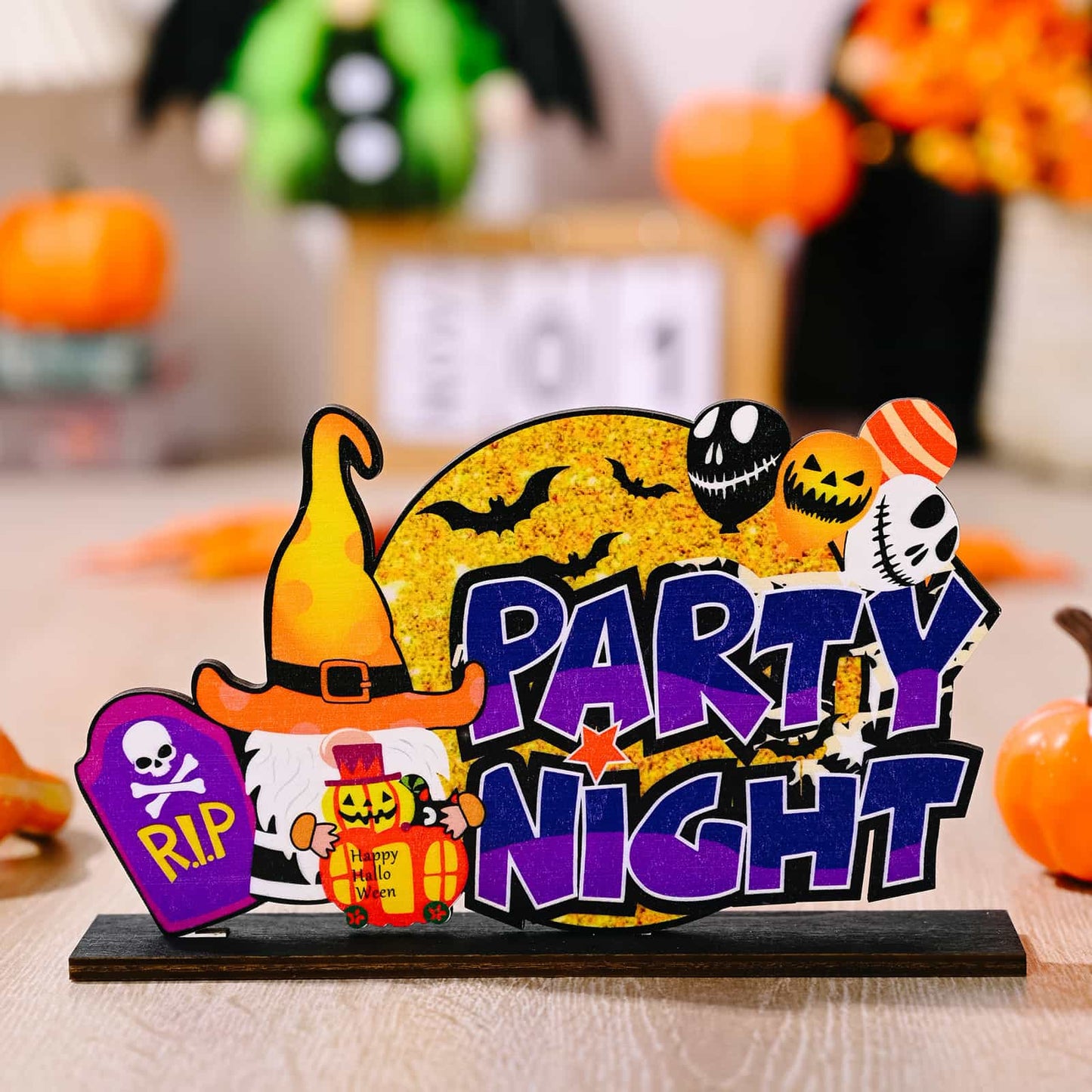 A Halloween ornament featuring a gnome, a tombstone, and the words "Party Night."