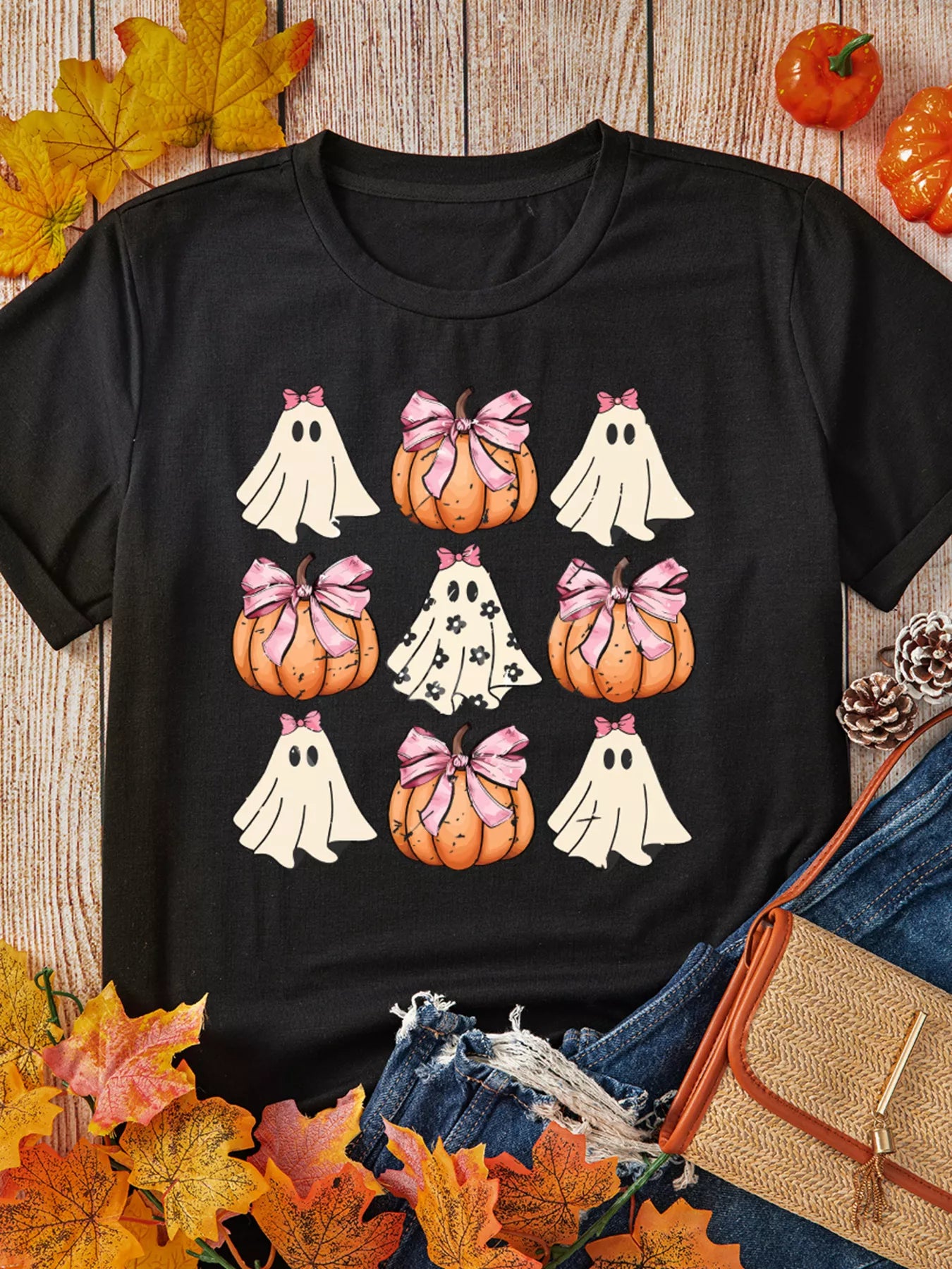 Black t-shirt with a Halloween ghost and pumpkin graphic.