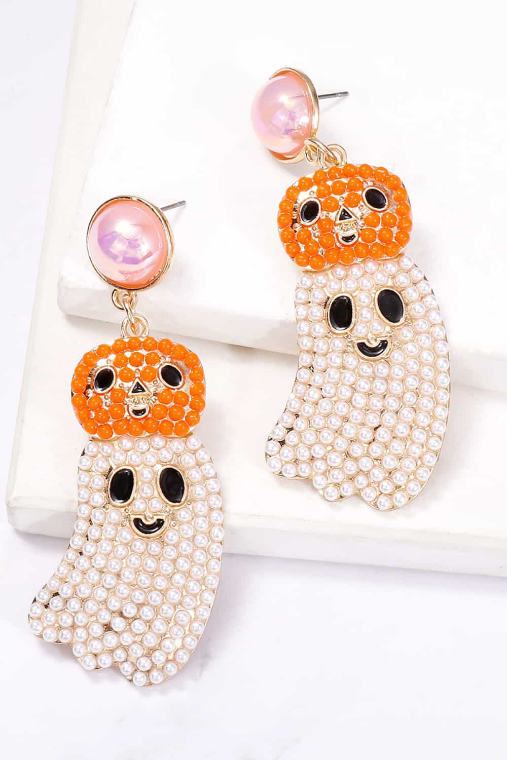 Halloween ghost shape dangle earrings with pearl and pumpkin accents.