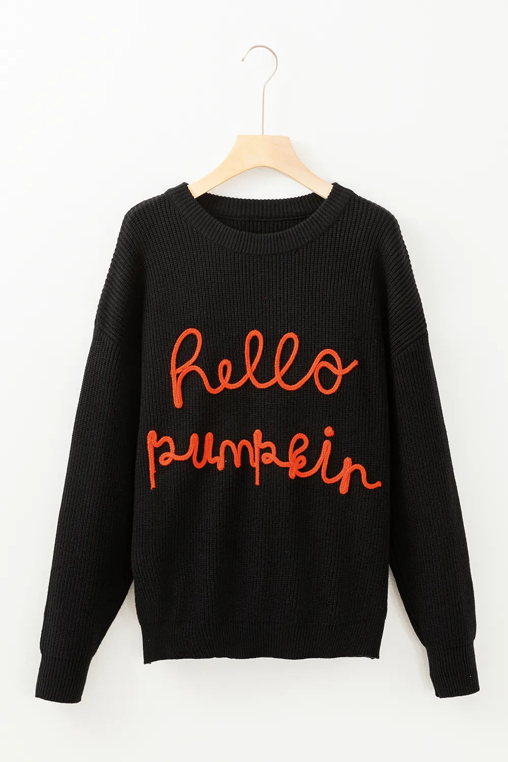 Black long-sleeve sweater with "hello pumpkin" embroidered in orange.