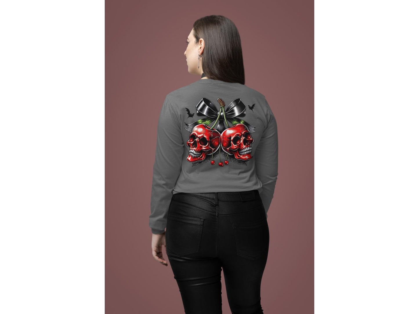 A woman from behind wears a gray long-sleeve shirt with a spooky cherry design.