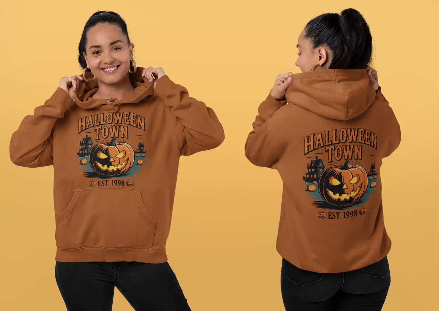 A woman models a brown Halloween Town hoodie with a vintage pumpkin graphic.