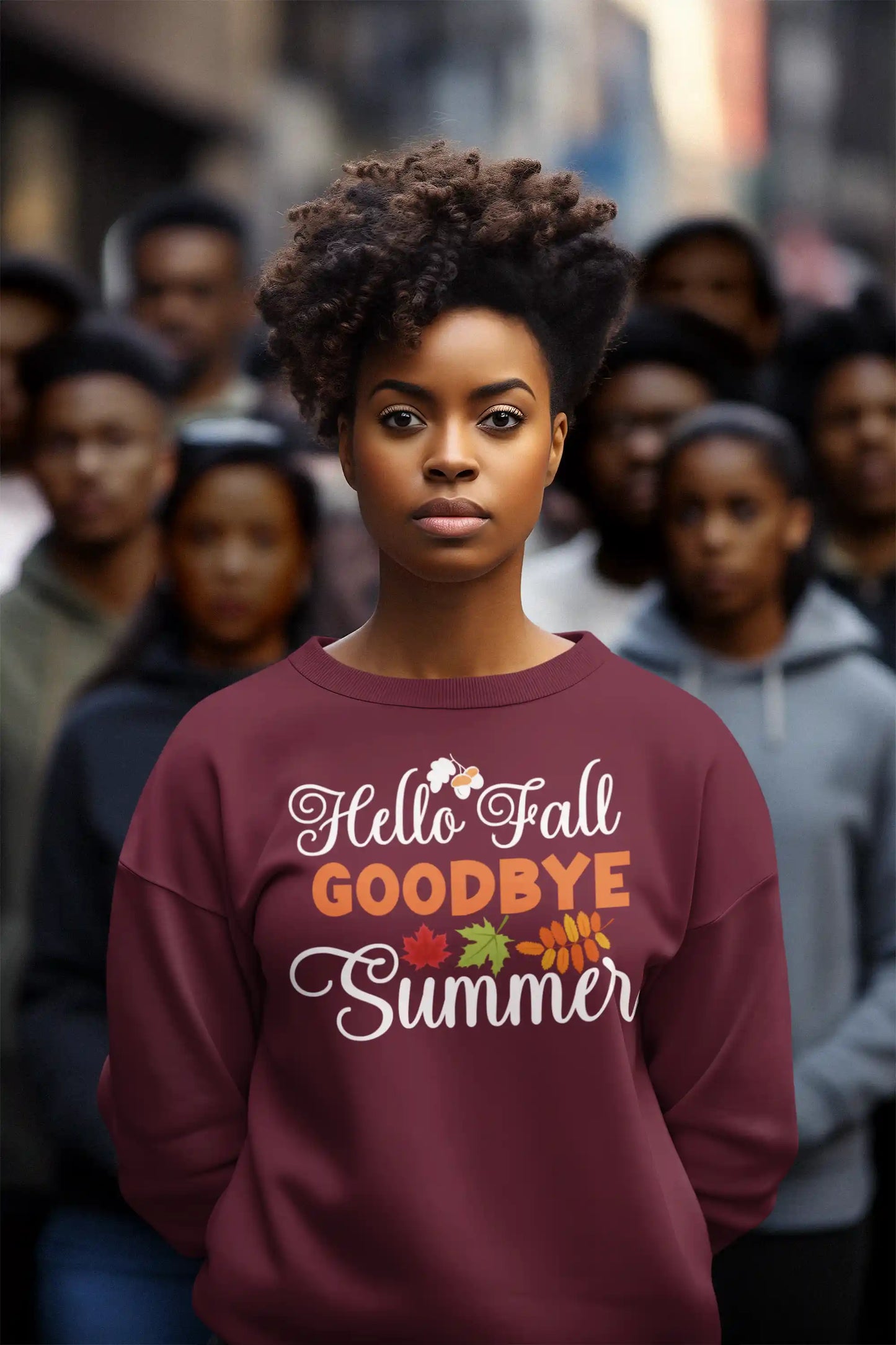 A woman wears a maroon "Hello Fall GOODBYE Summer" sweatshirt with autumn leaf graphics.