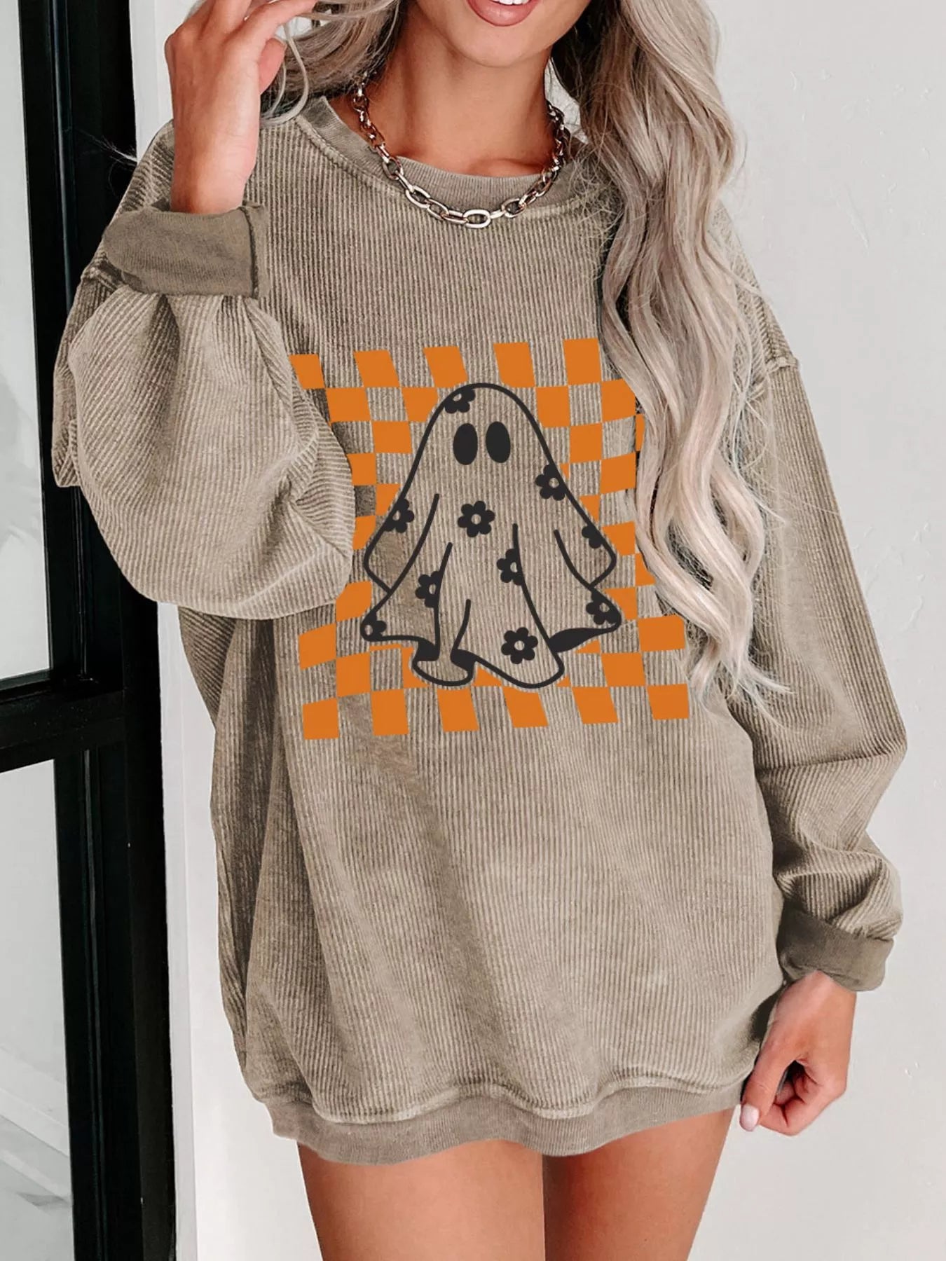 Halloween checkerboard floral ghost graphic corded sweatshirt.