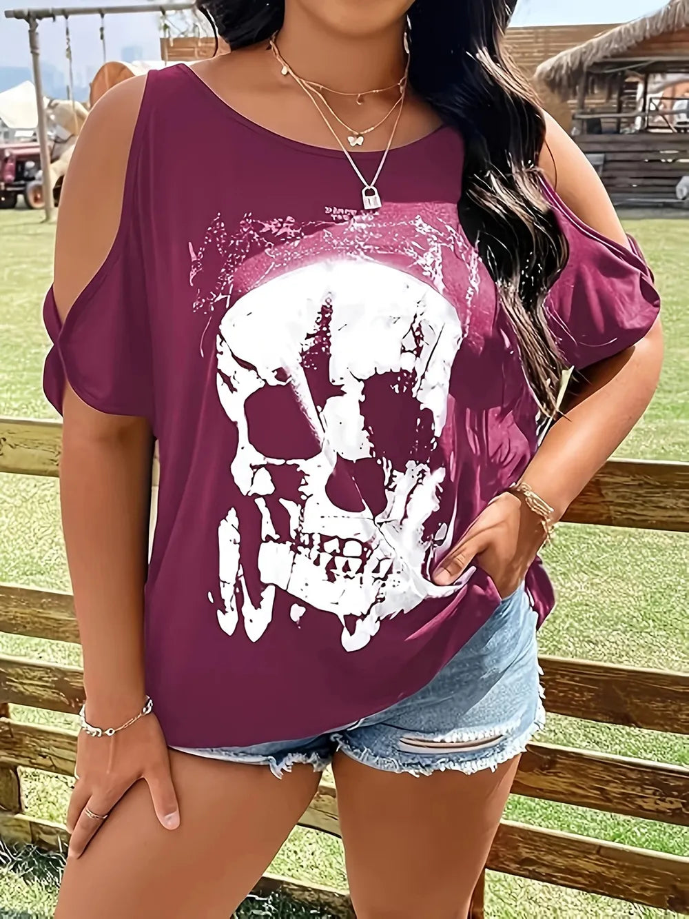 Plus size cold shoulder t-shirt with a white skeleton graphic.