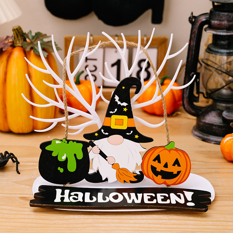A wooden Halloween decoration featuring a gnome, cauldron, pumpkin, and "HALLOWEEN!" text.