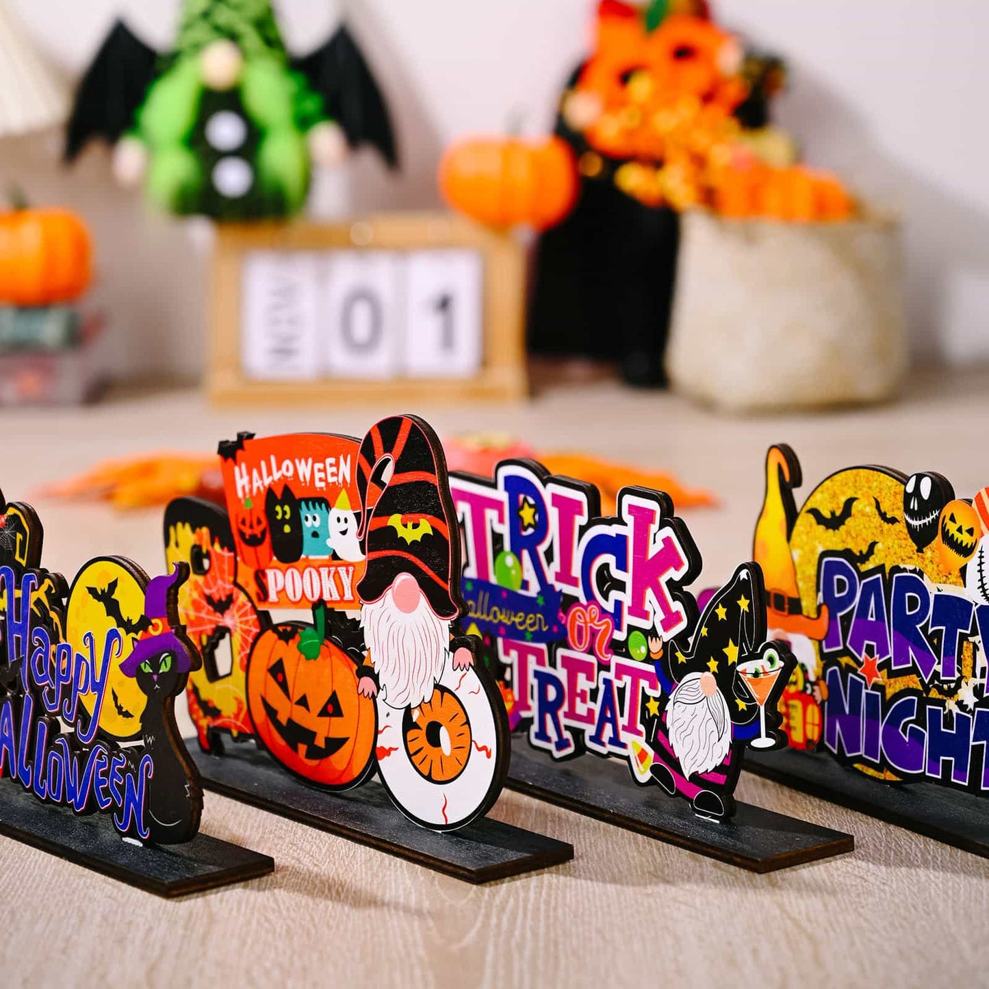 Assorted Halloween element ornaments featuring gnomes, pumpkins, and spooky phrases.