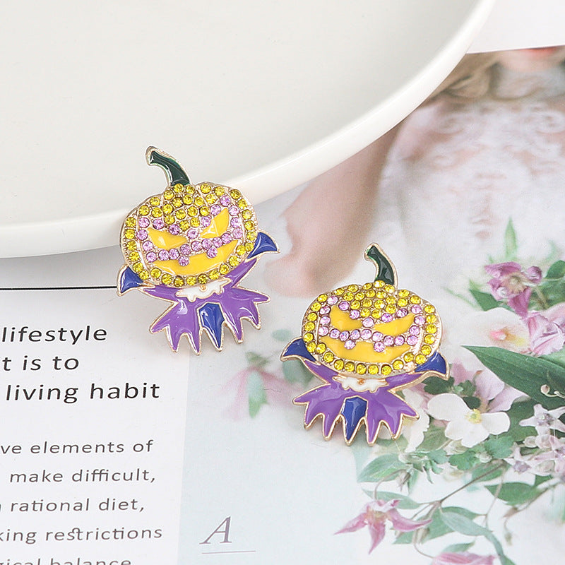 Two demon pumpkin rhinestone alloy earrings are displayed on a magazine page.