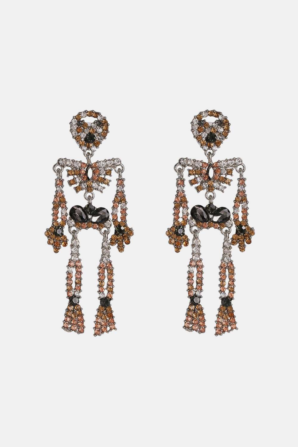 Skeleton-shaped dangle earrings adorned with clear, brown, and black glass stones.