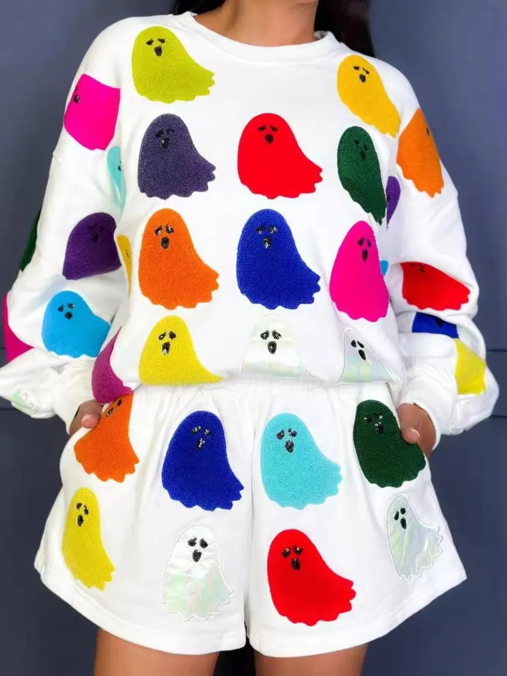 White long-sleeve top and shorts set with colorful ghost appliques.