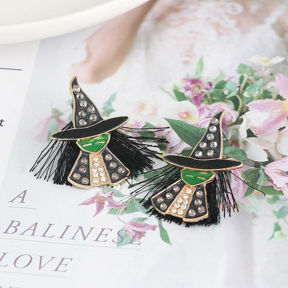 Two witch-shaped rhinestone alloy earrings with green faces and black tassels.