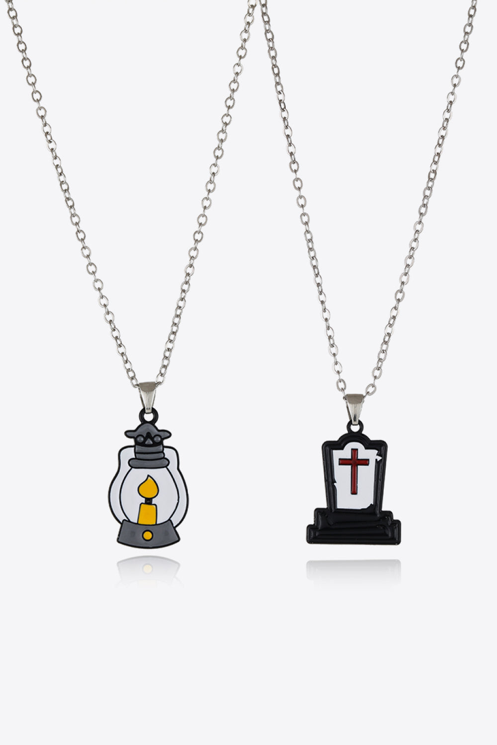 Two necklaces, one with a lantern pendant and the other with a tombstone pendant.