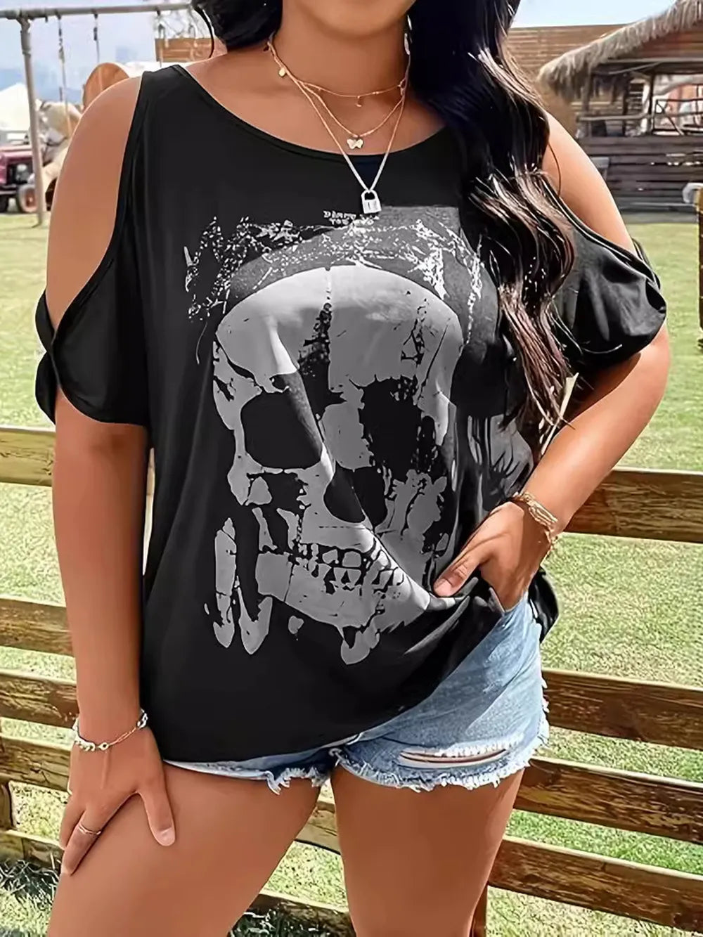 Plus size black cold shoulder t-shirt with a gray skeleton graphic.