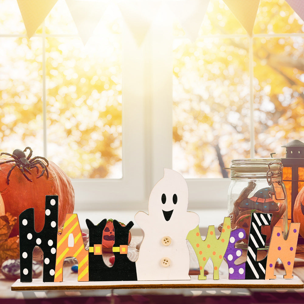A wooden Halloween sign spelling "HALLOWEEN" with a ghost in place of the "O".