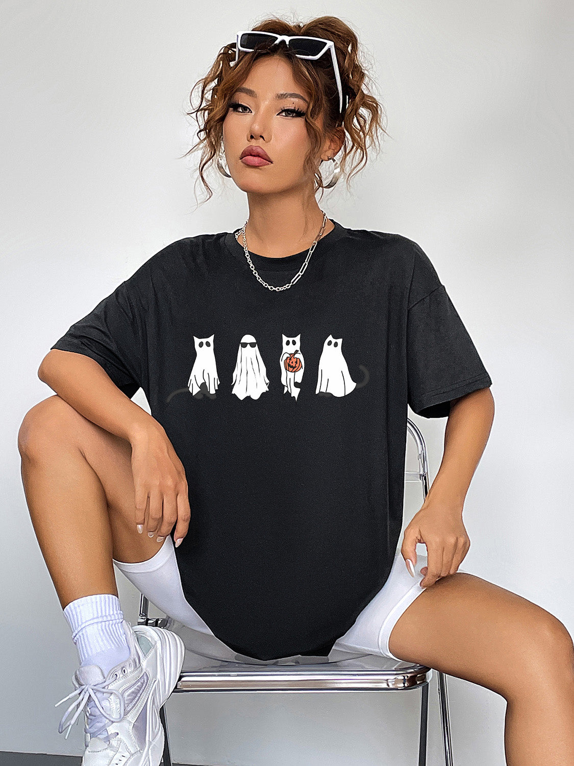 Round Neck Short Sleeve Ghost Graphic T-Shirt worn by a woman.