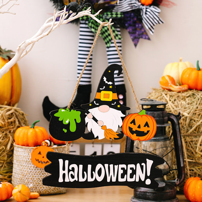 A Halloween hanging decoration featuring a gnome, cauldron, pumpkin, and "HALLOWEEN!" text.