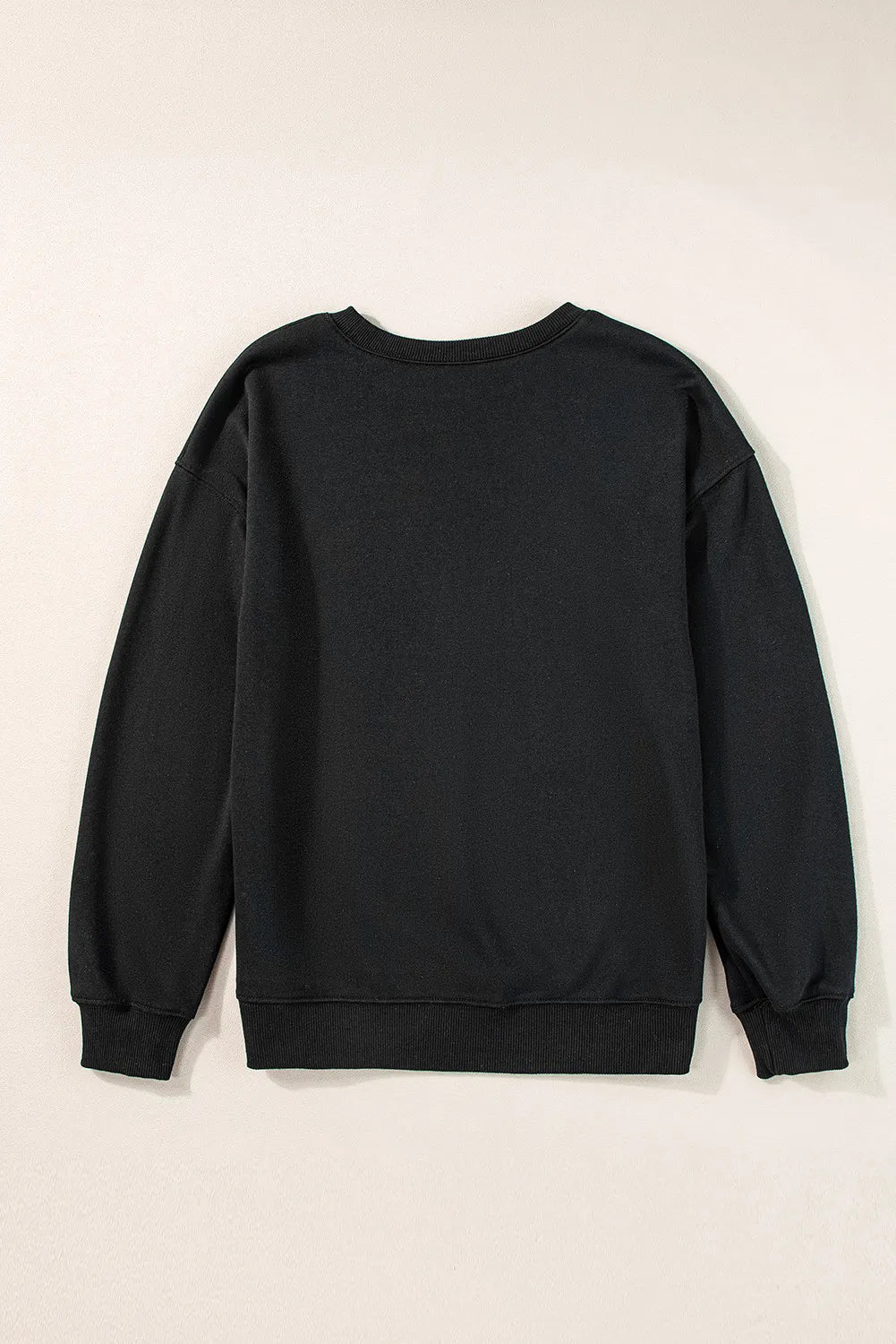 Back of a black long-sleeve sweatshirt with a round neck and ribbed cuffs and hem.