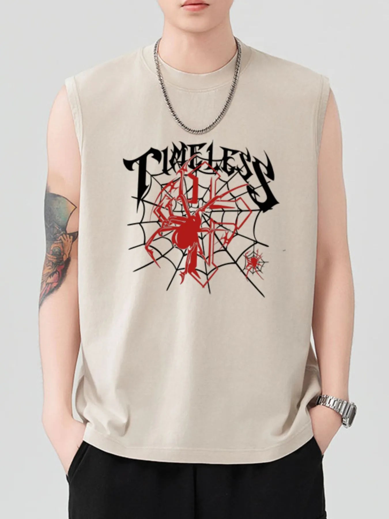 Men's beige sleeveless tank top with a black and red spiderweb graphic.